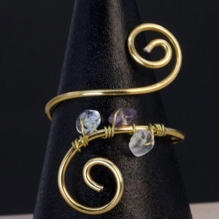 Anello in quarzo ialino e ametista | spirale dorata leggera
